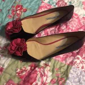 Via Spiga black peep toe with pinkish flower at the toe.